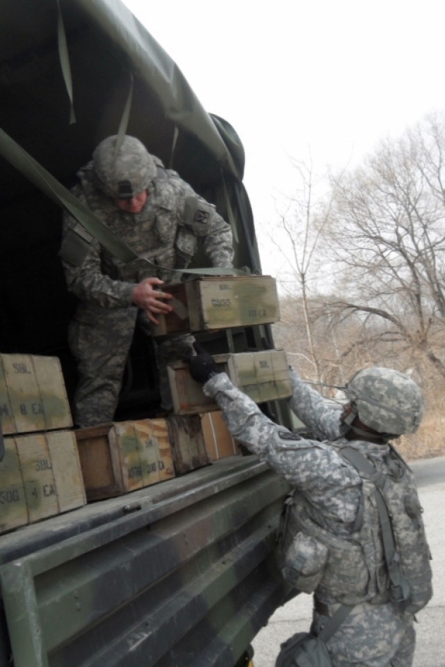 Soldiers unload ammo truck