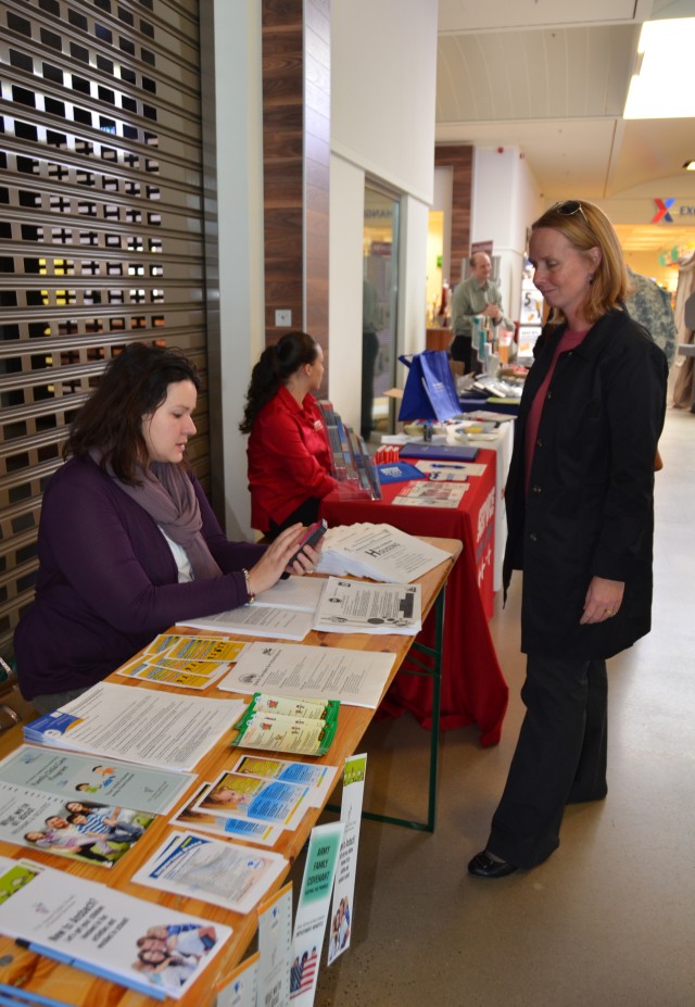 A new community member receives information during the Relocation Showcase.