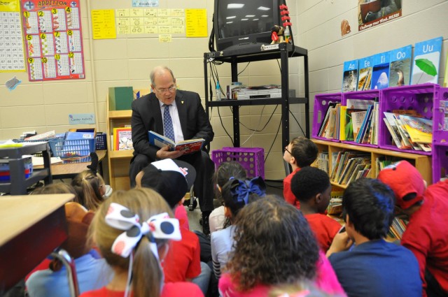 AMC top executive reads to a first grade class