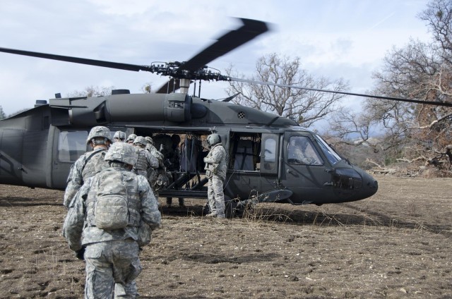 Soldiers load Black Hawk