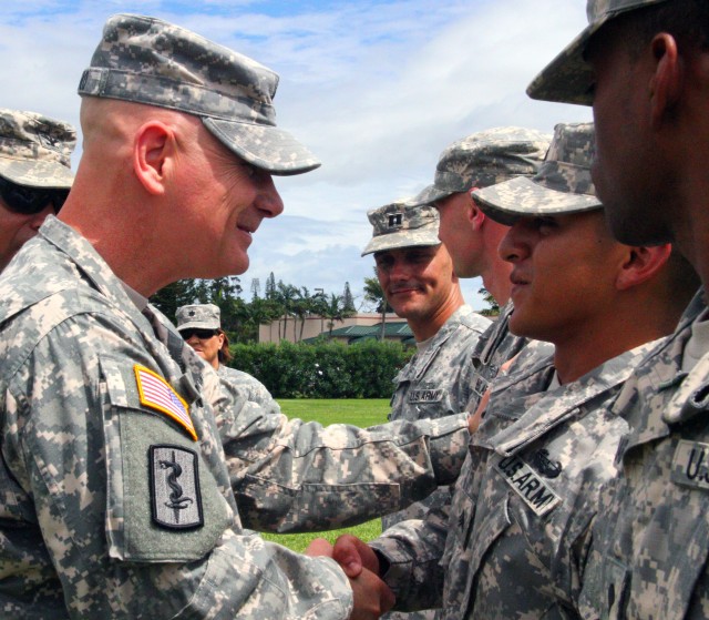 CSM Luciano shakes hands with PRMC Air Assault graduates