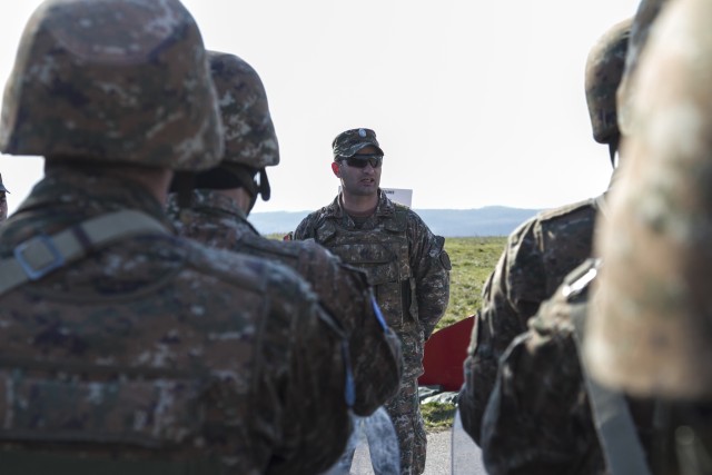 Platoon leader addresses troops before hot load training