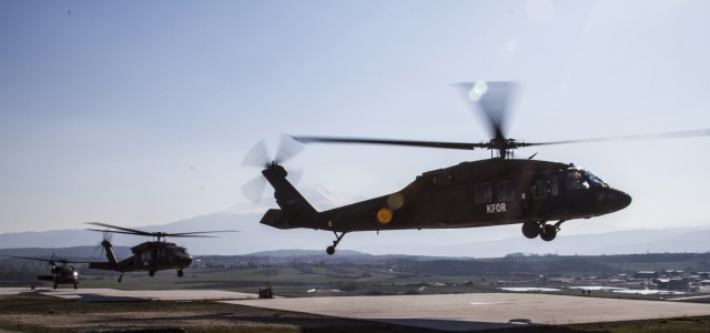 Helicopters lift off at Camp Bondsteel, Kosovo