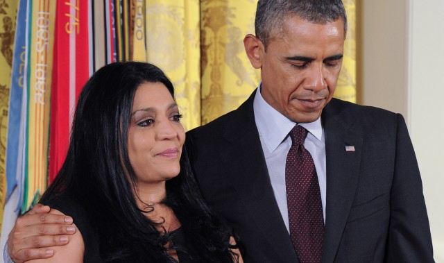 Tears Streaming Down, Obama Comforts the Lenora Daughter of MOH (posthumous) Recipient Leonard Alvarado