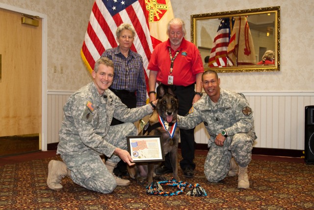 Max receives certificate, medal and toys