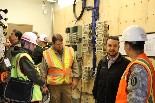 Lt. Col. Eddie Galarza-Gonzalez lead tour of completed facilities communication infrastructure areas