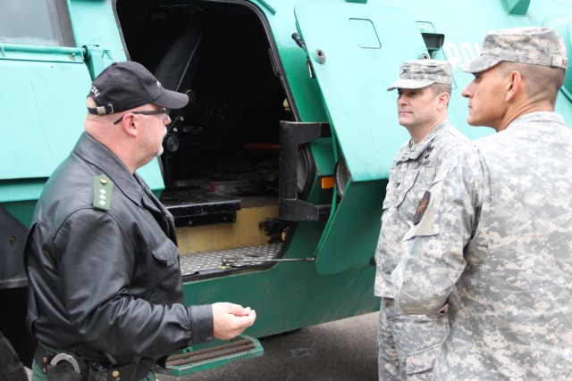 PHK Kern shows his armored vehicle to the USAG Ansbach command