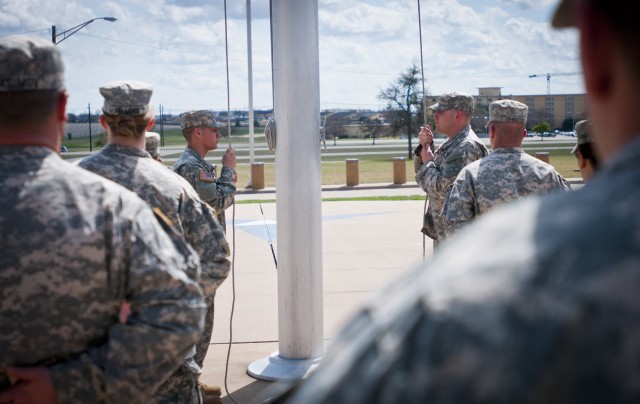 III Corps formation brings in the colors during Retreat ceremony
