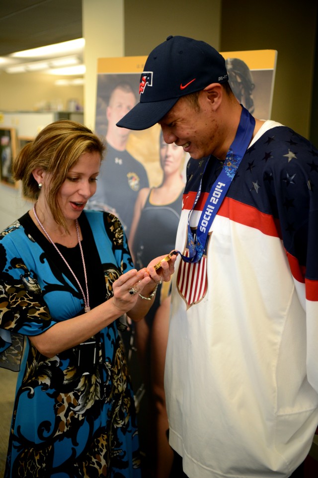 Adriana Wertz admires SSG Jen Lee's gold medal