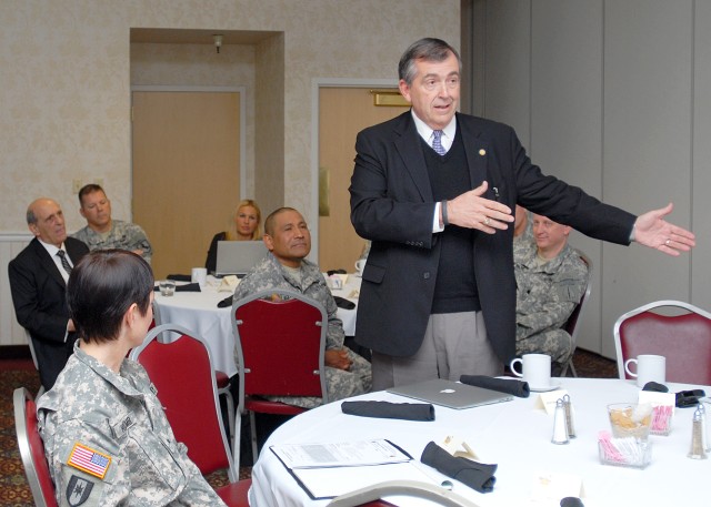 Retired Army Gen. Peter Chiarelli speaks before TBI Summit