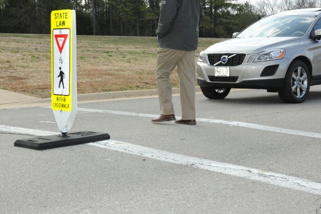 Signs warn motorists to be aware of crosswalk safety