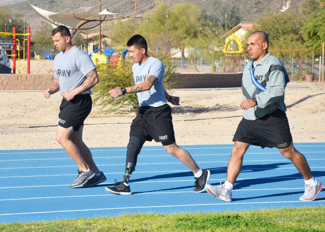 Spc. Kevin Nguyen conducts an APFT
