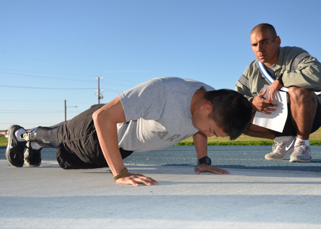 Spc. Kevin Nguyen performs pushups