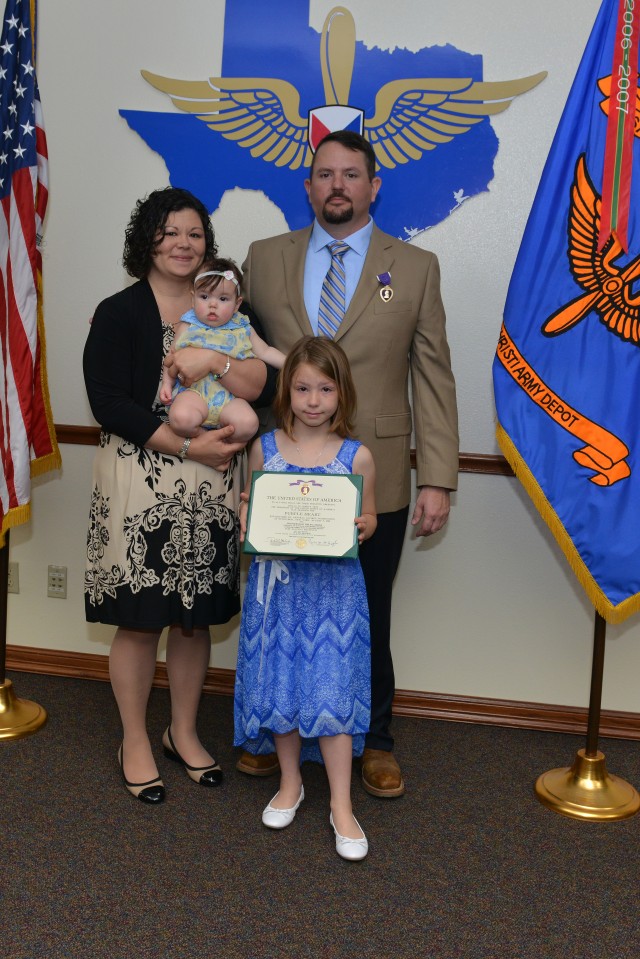 Philip Derise poses with family