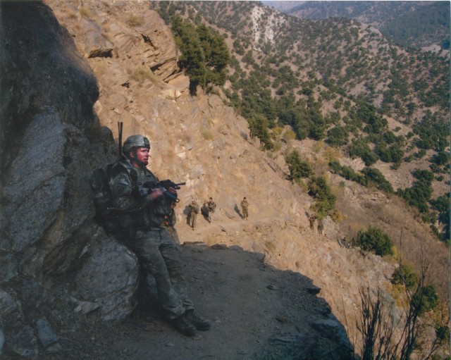 Spc. Kyle J. White Rests on Hike Up Mount