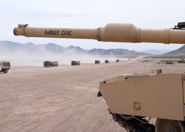 138th Quartermaster Company approaches a M1 Abrams main battle tank