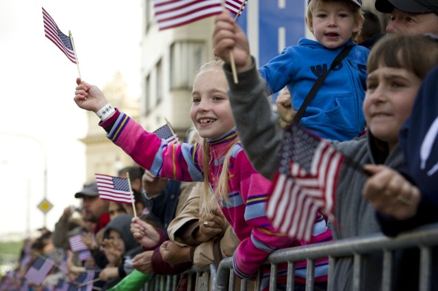 The Stars and Stripes wave as U.S. WWII veterans take part in Pilsen's Liberation Festival Parade