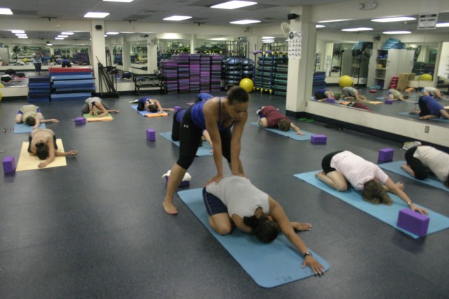 Army MWR patrons enjoy yoga at fitness center 