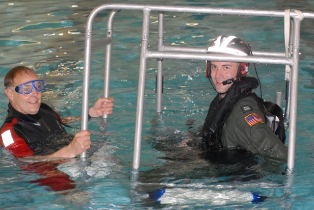 Pilots receive water evacuation training from Coast Guard rescue swimmers