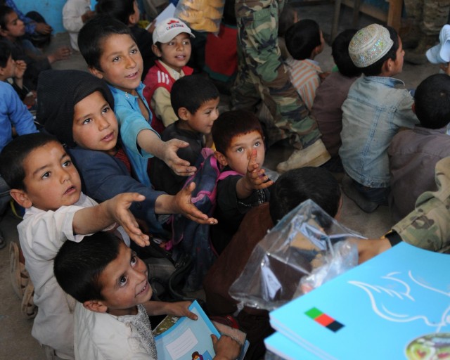 Students near Shindand get new supplies, shoes