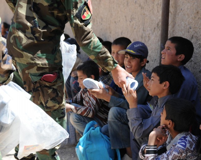 Students near Shindand get new supplies, shoes