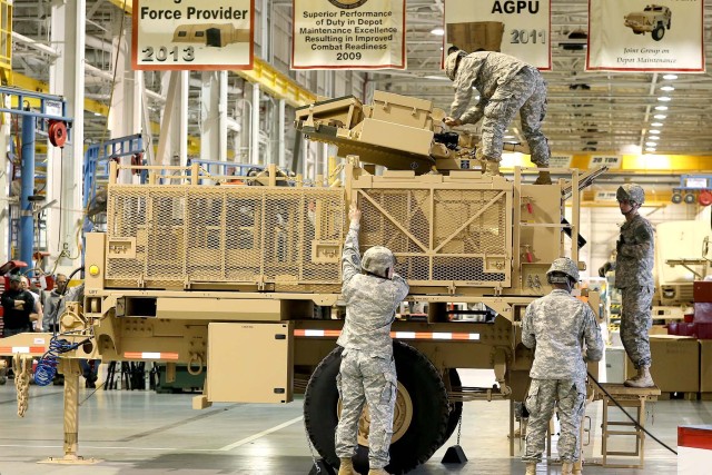 Soldiers rollout FMTV prime mover and emplace Sentinel Radar
