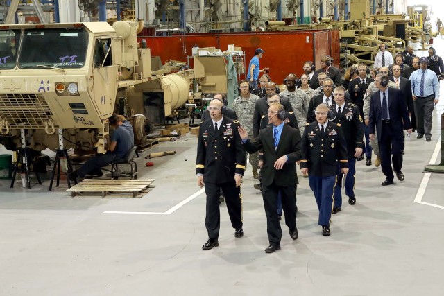 Guests tour maintenance facility after ceremony