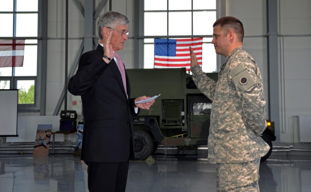 Secretary of the Army performs impromptu reenlistment in Latvia