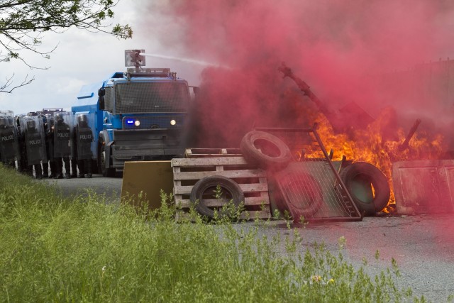 Water cannon breaks down barriers
