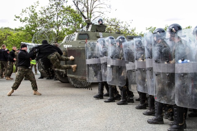 Charging the riot gates
