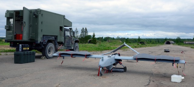 Shadow UAV with bunkers in background