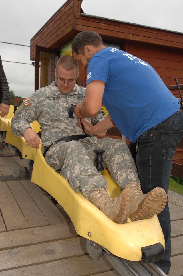 Army medic takes a ride on rail tobaggan