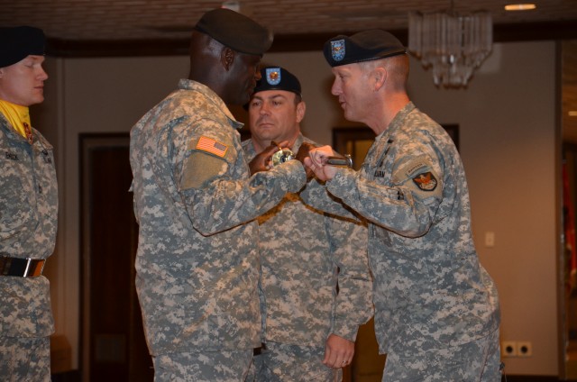 Command Sgt. Maj. Norriel Fahie receives noncommissioned officer sword