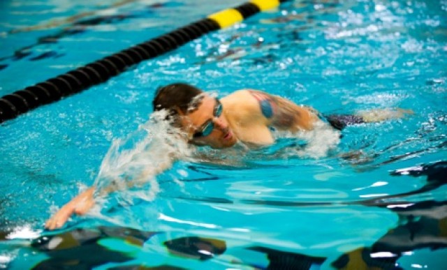 Retired Sgt. Matthew Spang, a bi-lateral amputee below the knee, swims on the first day of practice for the 2014 U.S. Army Warrior Trials at West Point, NY.