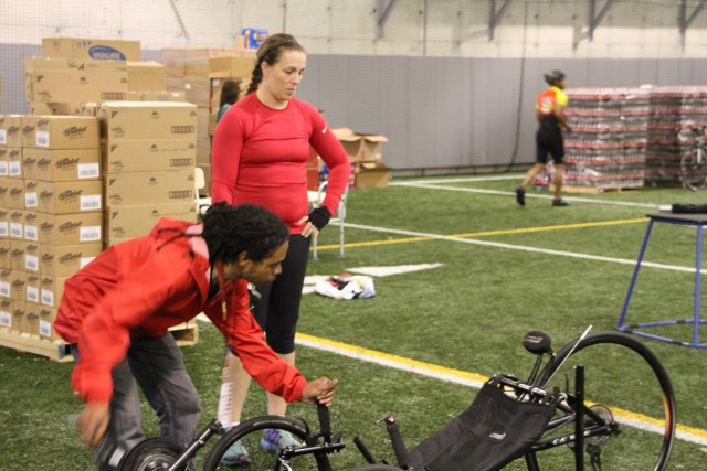 Sgt. Brennan gets her bike inspected before the 2014 Army Warrior Trials Begin