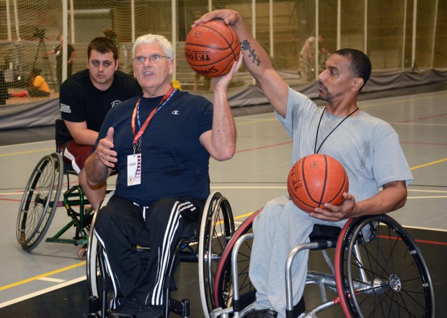 Wheelchair basketball coaches demonstrate ball-handling techniques at the 2014 Warrior Trials