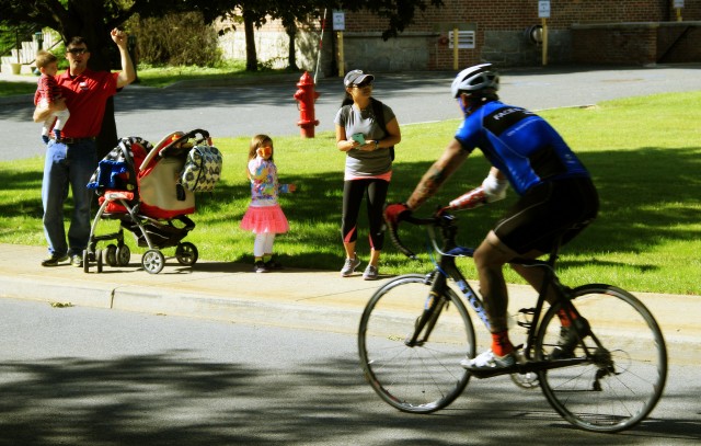 West Point community members cheer on cyclist during the 2014 Warrior Trials 
