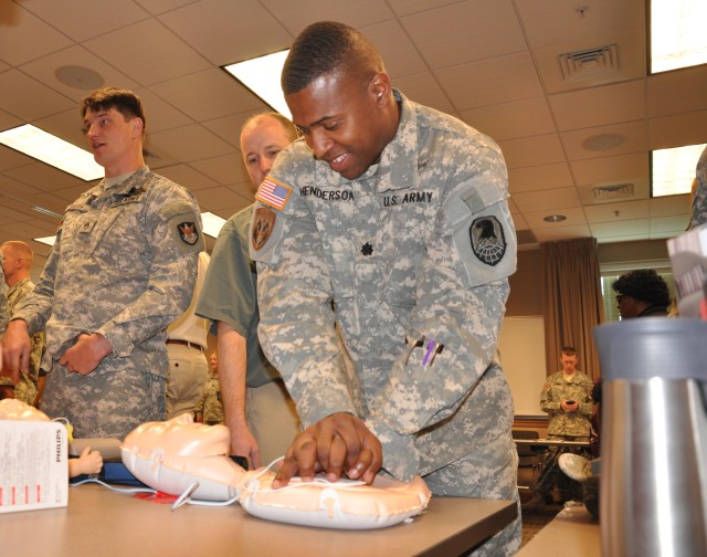 Lt. Col. Courtney Henderson practices chest compressions