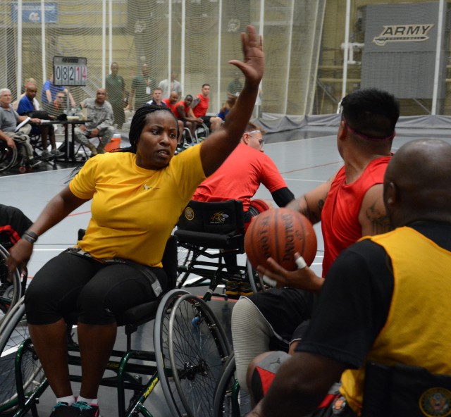 Staff Sgt. Williams tries to block her competitor during the 2014 Army Warrior Trials