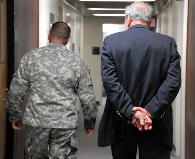 Col. Amos Mathews (retired) tours the district headquarters building