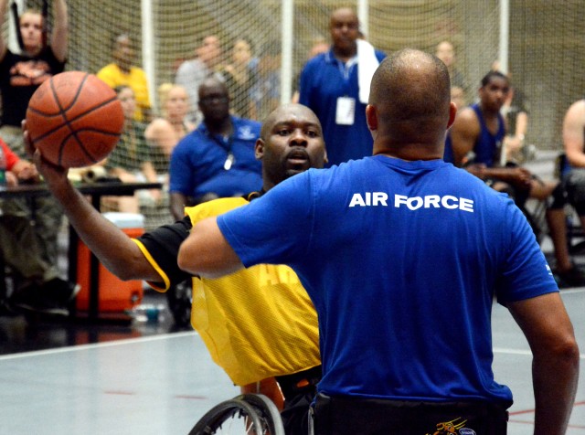 Army and Air Force athletes compete in the wheelchair basketball final game at the 2014 Warrior Trials.