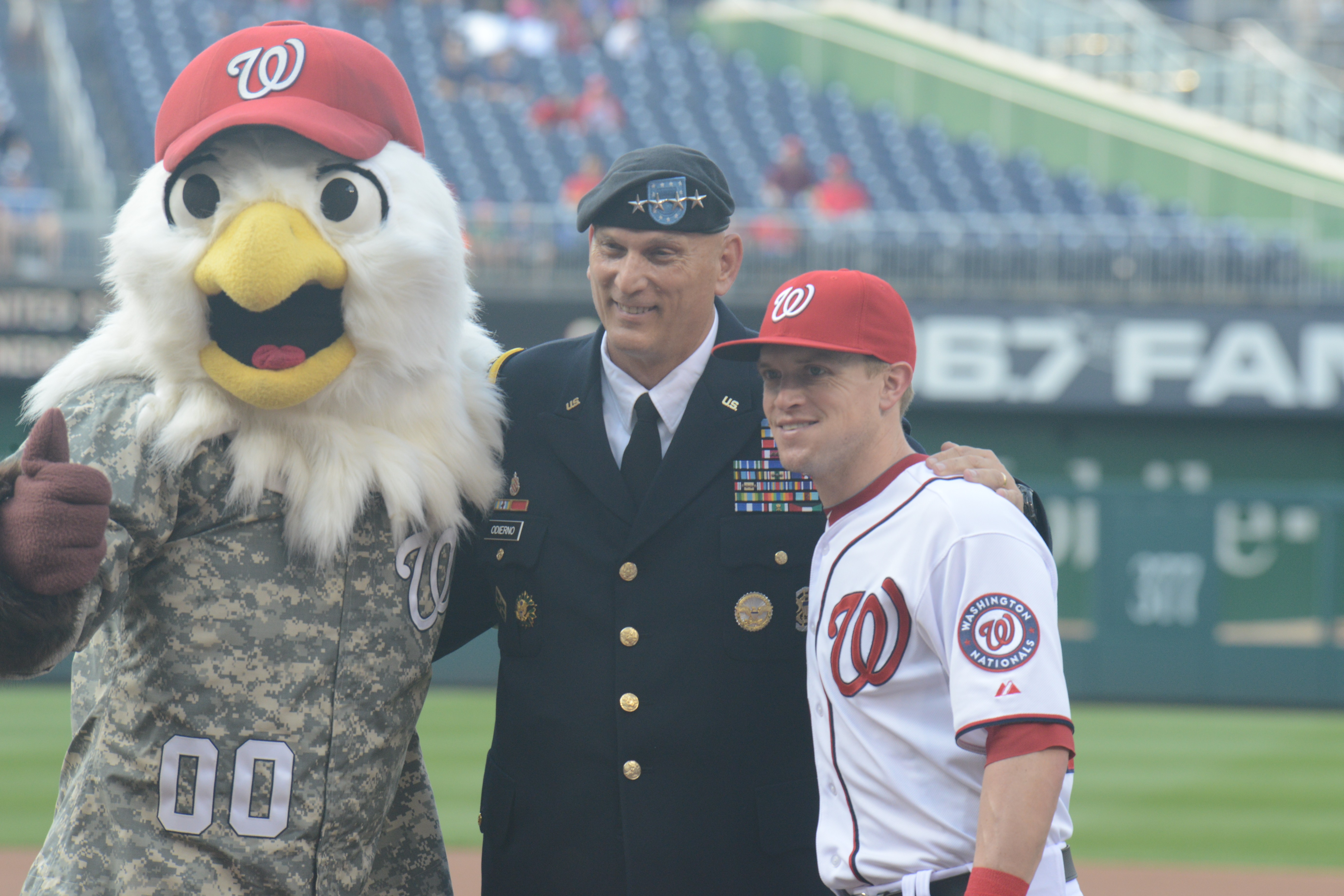 Screech, the Washington Nationals' mascot, offers Chief Navy