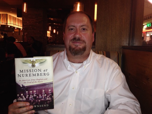 Author Tim Townsend with his book, "Mission at Nuremberg"