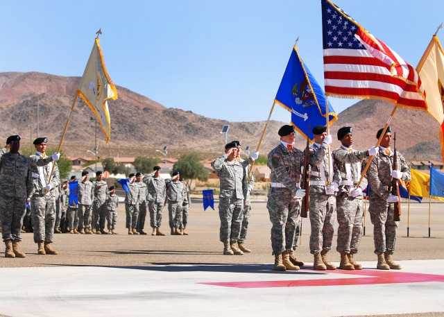 LTC Fernando Guadalupe (center) salutes