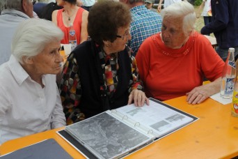 In 1951, the residents of Schmidheim village in Germany, were relocated to make way for the expansion of Hohenfels Training Area. Roughly 60 guests assembled at the remains of the village, July 5, 2014, to share memories, honor those who have passed,...