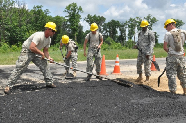 Army engineers pave training convoy road