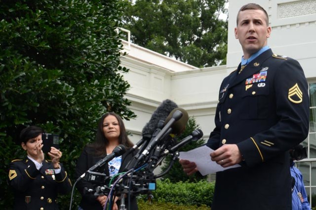 Staff Sgt. Ryan Pitts speaks to the media