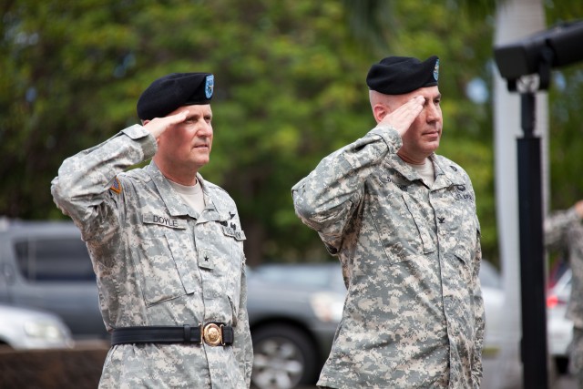 Incoming and outgoing Tripler Commanders present arms