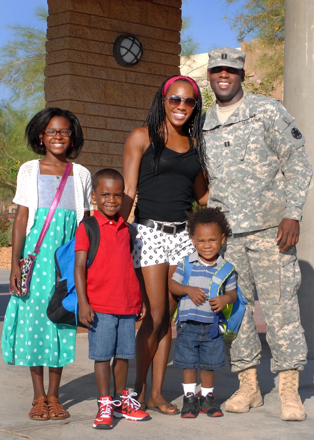 CPT Michael Watkins and family at Lewis Elementary