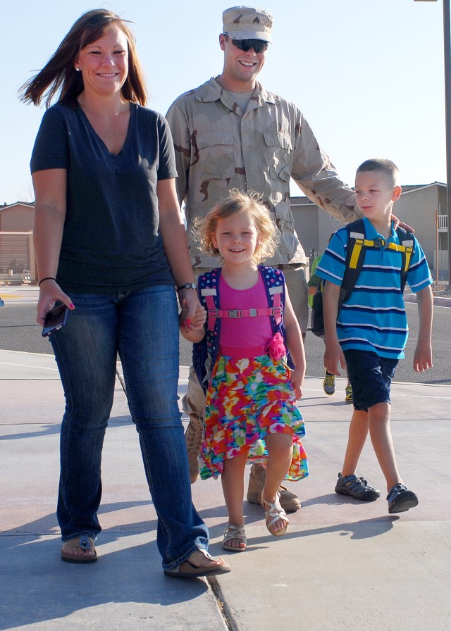 Family walks to Lewis Elementary School